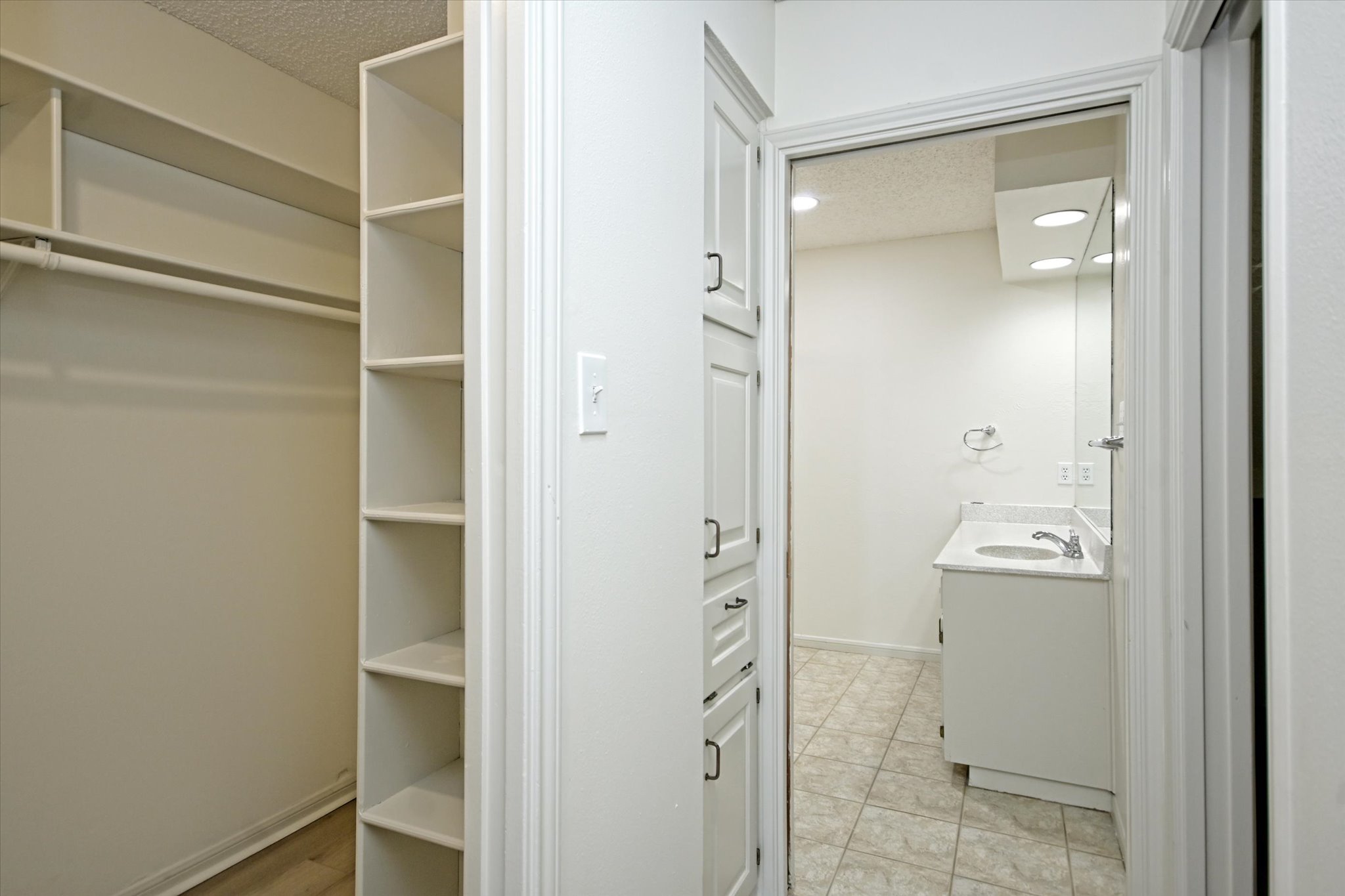 105 Crescent Bluff Austin, TX 78734 - Photo 13 of 28 a bathroom with a granite countertop mirror