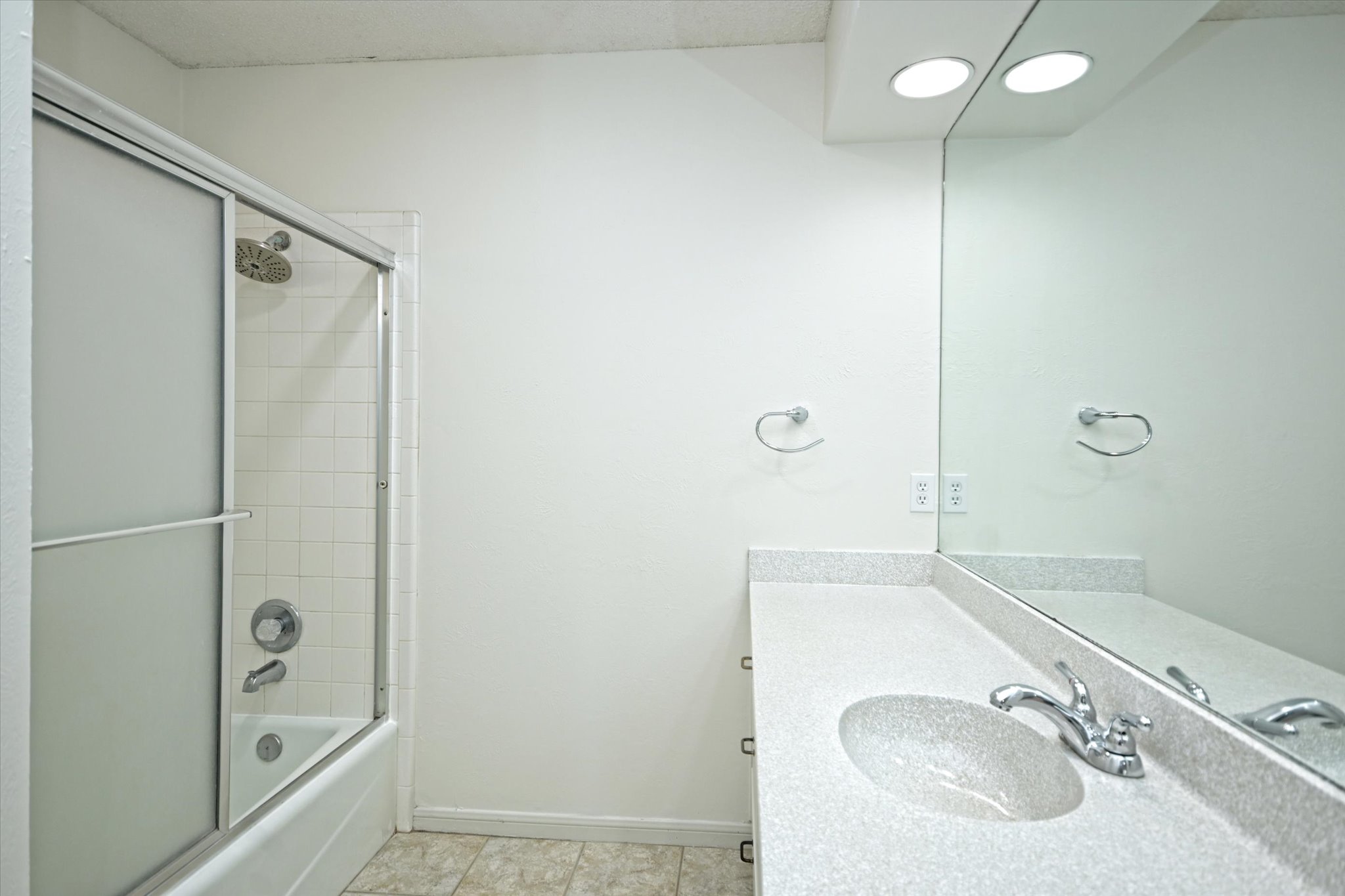 105 Crescent Bluff Austin, TX 78734 - Photo 14 of 28 a bathroom with a sink and a mirror