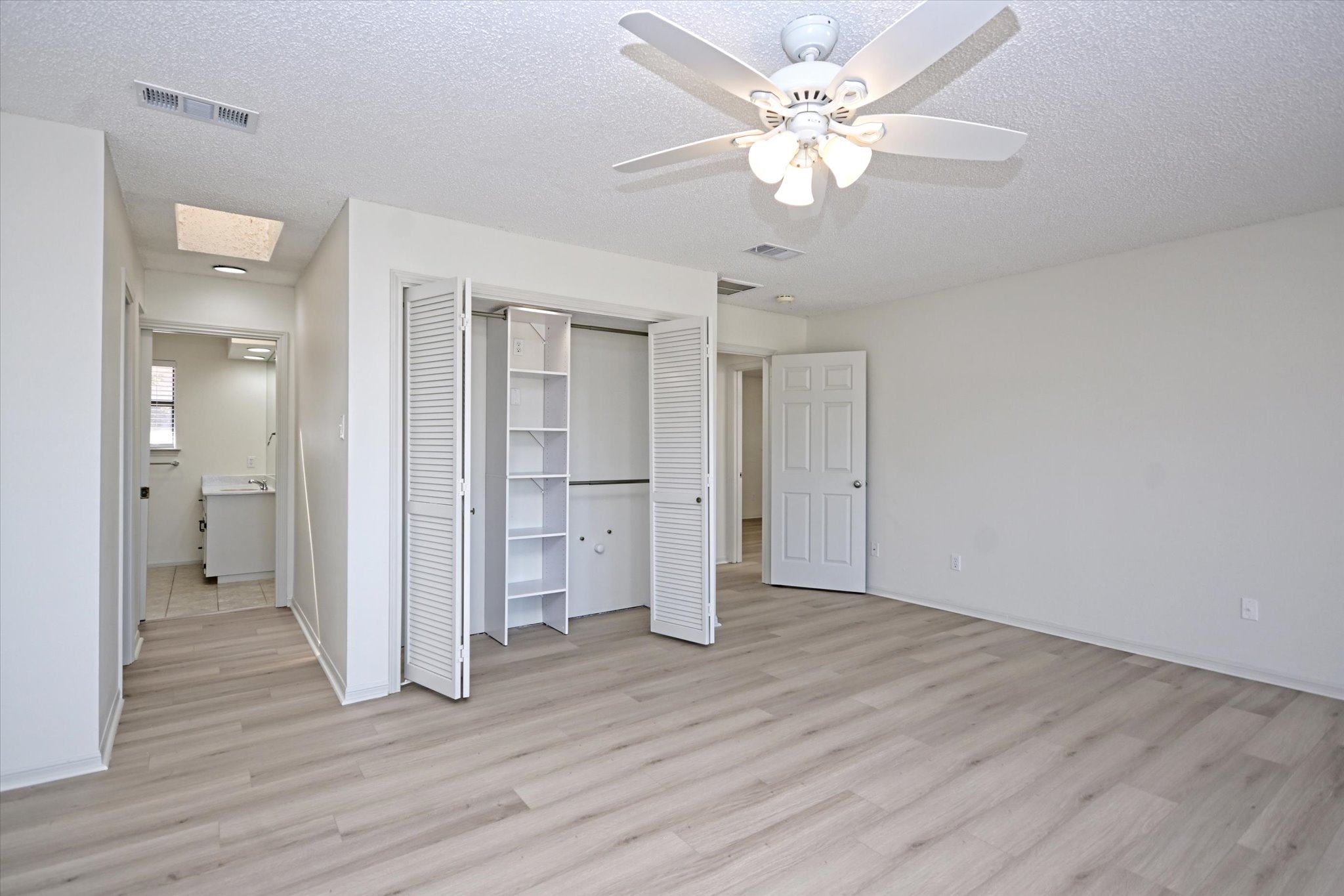 105 Crescent Bluff Austin, TX 78734 - Photo 17 of 28 a view of an empty room with wooden floor