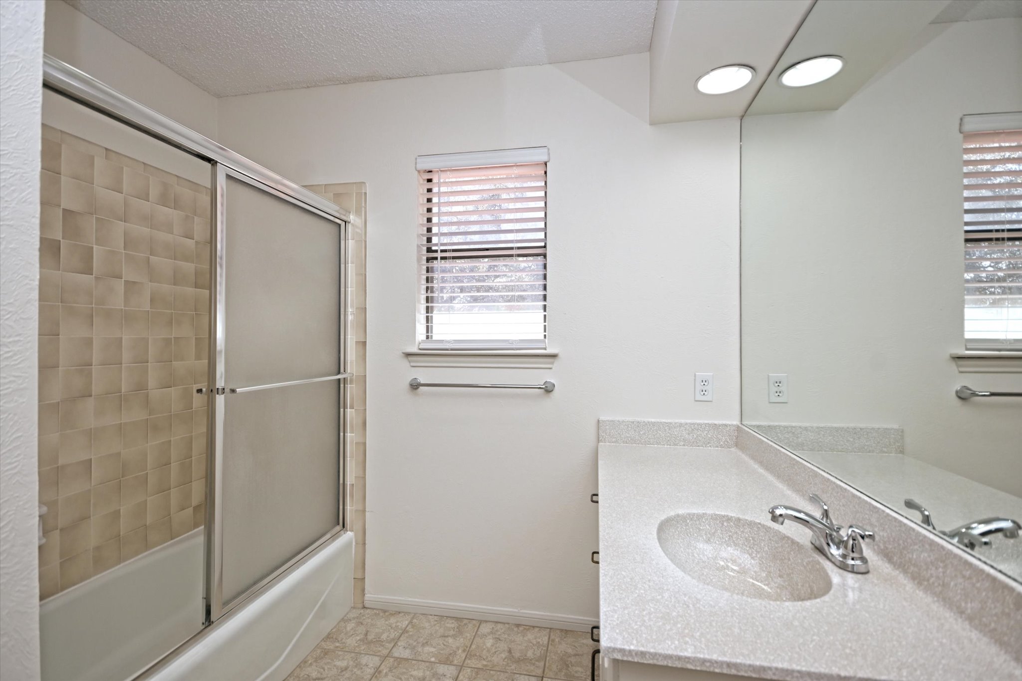 105 Crescent Bluff Austin, TX 78734 - Photo 18 of 28 a bathroom with a sink and a mirror