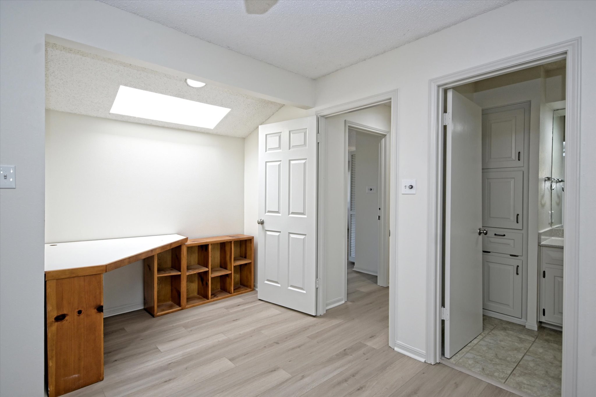 105 Crescent Bluff Austin, TX 78734 - Photo 20 of 28 a view of an empty room with wooden floor