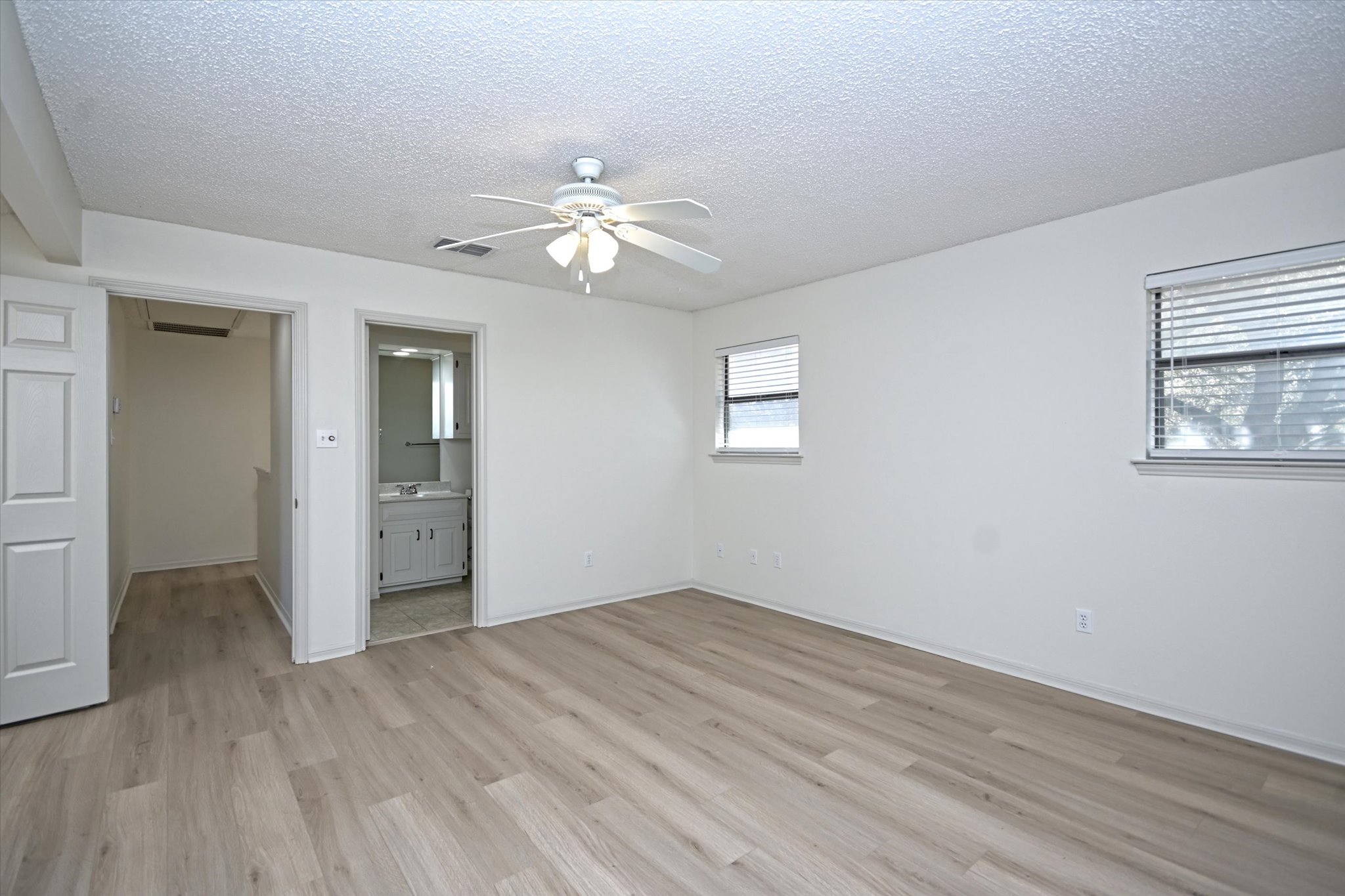 105 Crescent Bluff Austin, TX 78734 - Photo 21 of 28 wooden floor in an empty room with a window