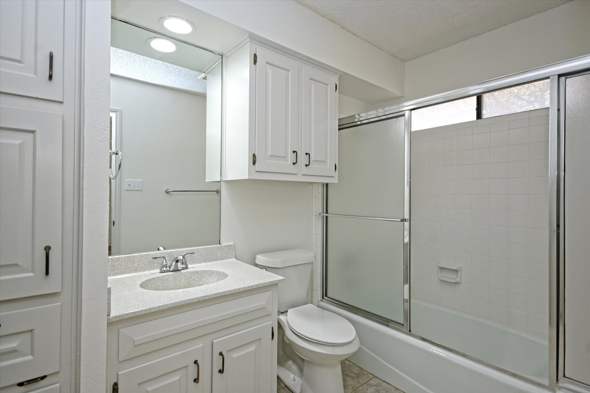 105 Crescent Bluff Austin, TX 78734 - Photo 22 of 28 a bathroom with a sink toilet and shower