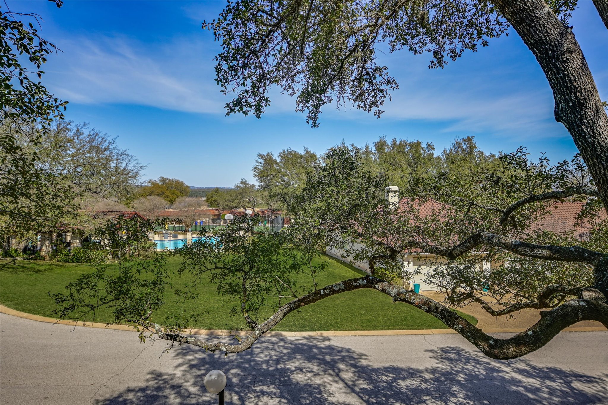 105 Crescent Bluff Austin, TX 78734 - Photo 26 of 28 a view of a yard with a tree