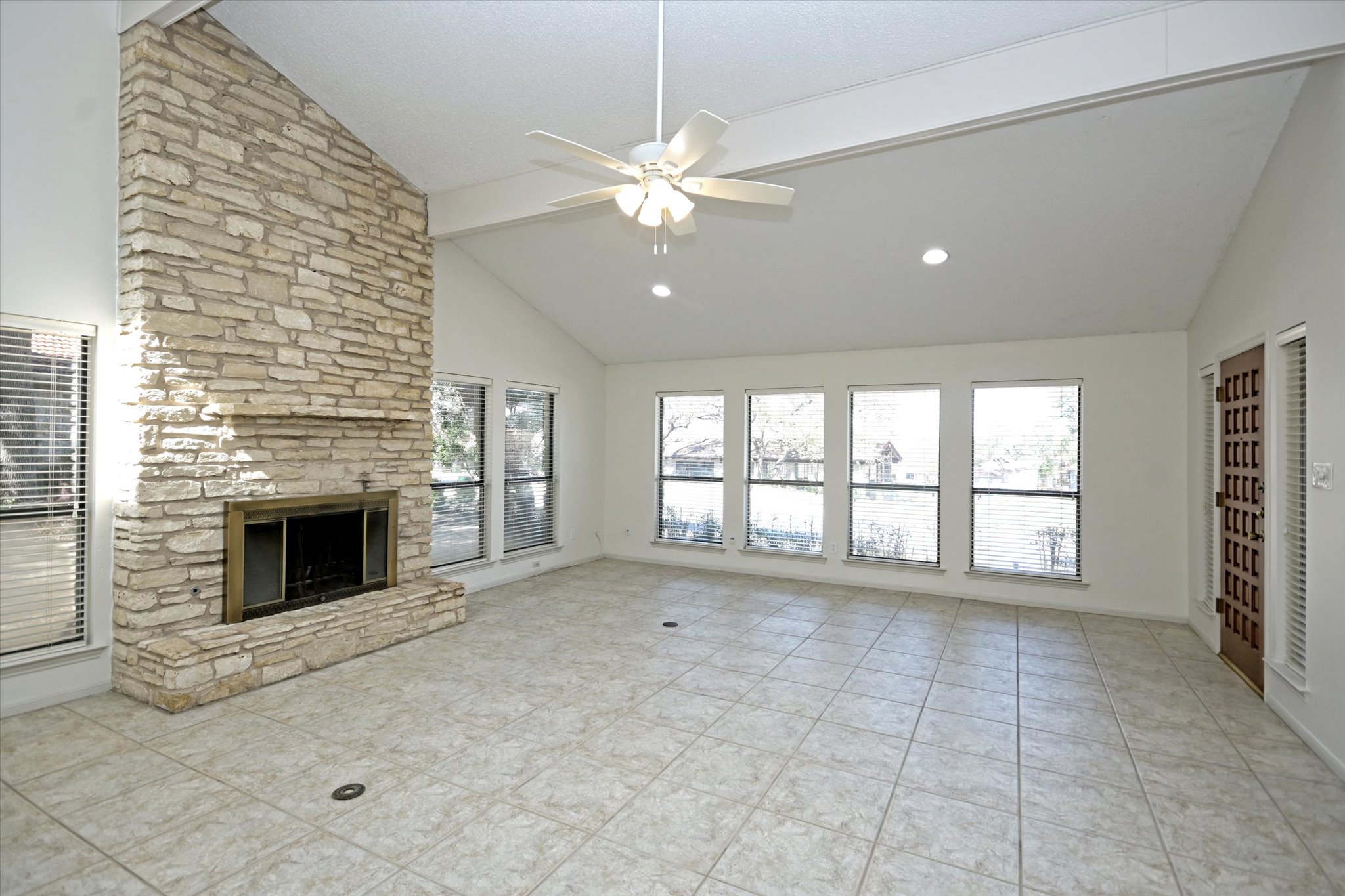 105 Crescent Bluff Austin, TX 78734 - Photo 5 of 28 a view of an empty room with a fireplace and a window