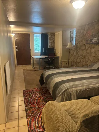 a metallic refrigerator freezer sitting in a kitchen