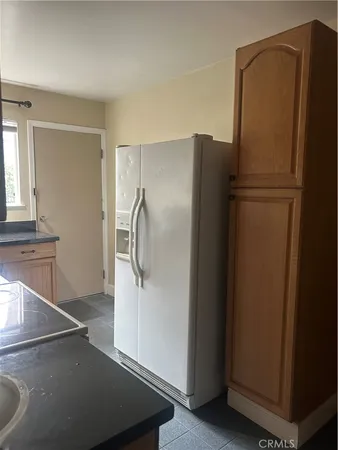 a spacious bedroom with a bed and a couch