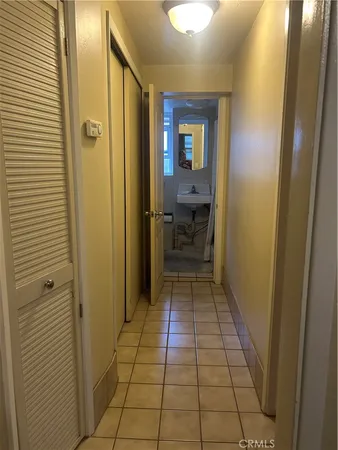 a view of a room with a table and chairs