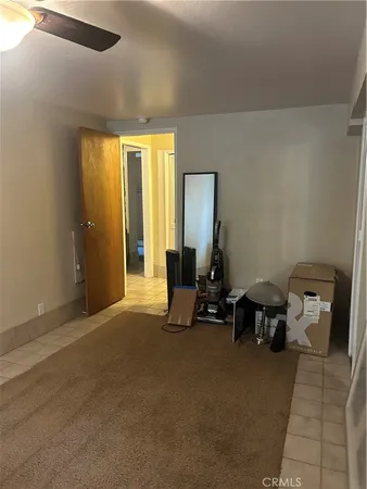 a view of house with garden space and car parked