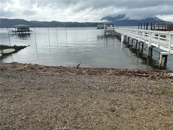 a view of a lake with a yard