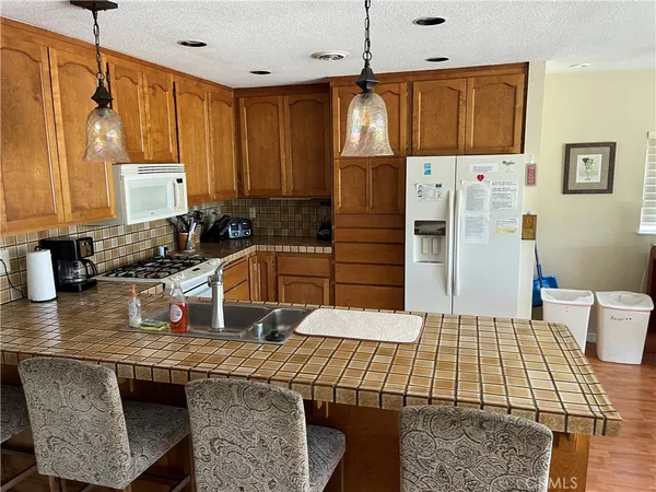 a bathroom with a sink a mirror and shower