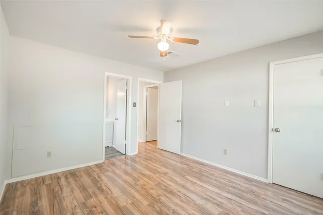 a view of a room with a ceiling fan