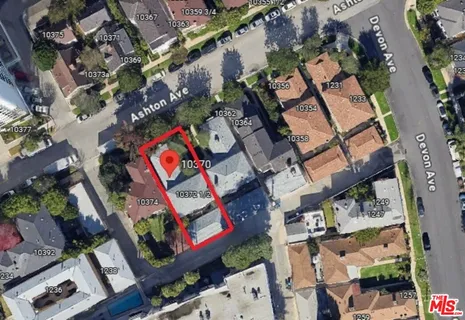 a kitchen with white cabinets and a stove