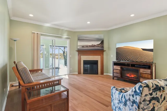 a kitchen with stainless steel appliances a sink cabinets and wooden floor