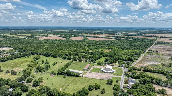 a view of a lake with houses in the back