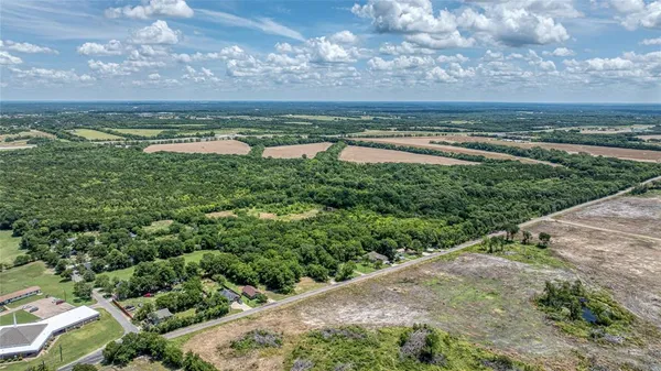 a view of an ocean with beach and outdoor space