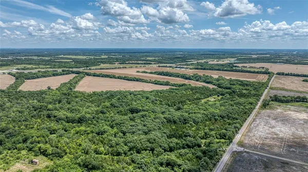 a view of a water pond with lots of green space