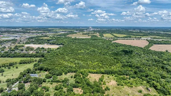 a view of a lake with houses in the back