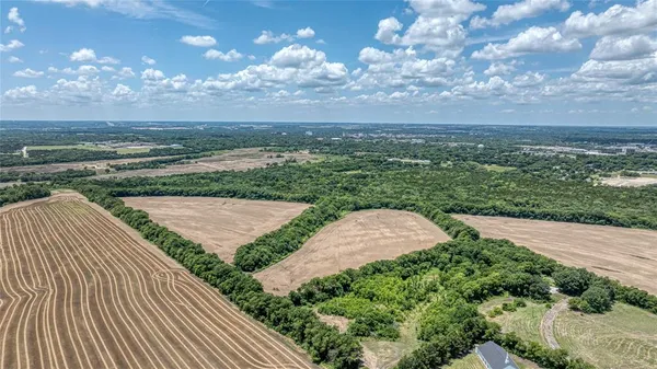 a view of a yard with an ocean