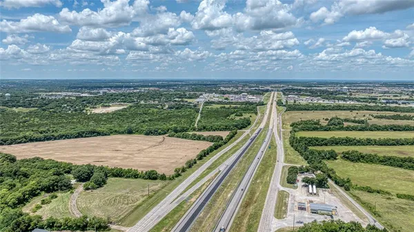 a view of a lake in the backyard of a house