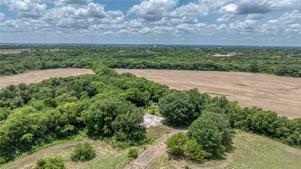 a view of a swimming pool with a yard