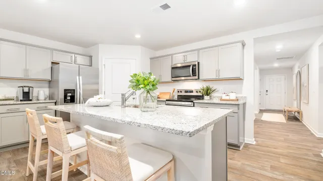 a bedroom with a large bed and a large window