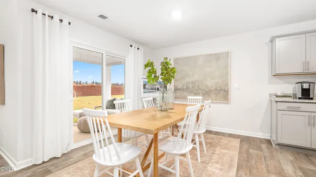 a bathroom with a granite countertop sink a toilet a mirror and shower