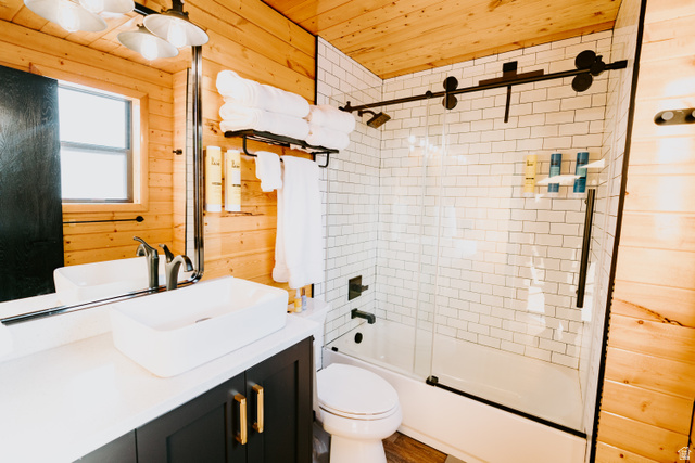 1413 Basel Drive Midway, UT 84049 - Photo 41 of 137 Full bath featuring wooden walls, enclosed tub / shower combo, vanity, and wood ceiling
