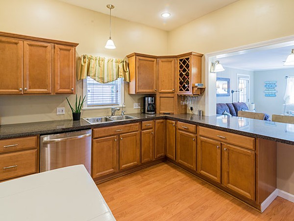 10 Metropolitan Avenue Ashland, MA 01721 - Photo 15 of 22 a kitchen with stainless steel appliances granite countertop a sink and cabinets