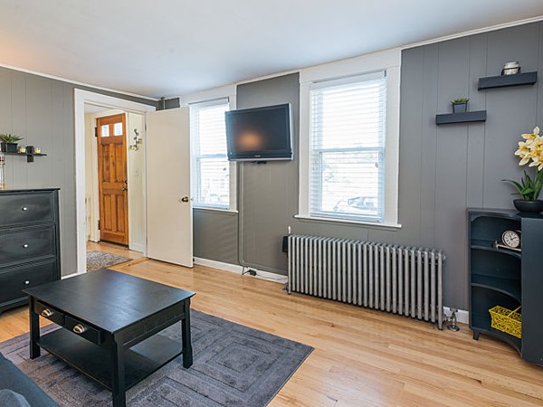 10 Metropolitan Avenue Ashland, MA 01721 - Photo 20 of 22 a living room with furniture a flat screen tv and a window