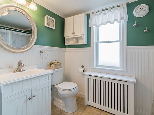 10 Metropolitan Avenue Ashland, MA 01721 - Photo 22 of 22 a bathroom with a sink mirror vanity and a toilet