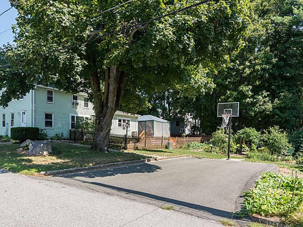 10 Metropolitan Avenue Ashland, MA 01721 - Photo 3 of 22 a view of a park with plants and large trees