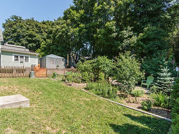 10 Metropolitan Avenue Ashland, MA 01721 - Photo 6 of 22 a backyard of a house with table and chairs