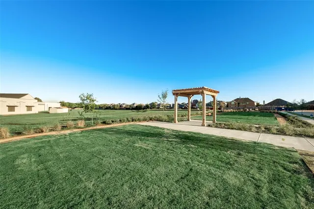 a view of a lake with a yard