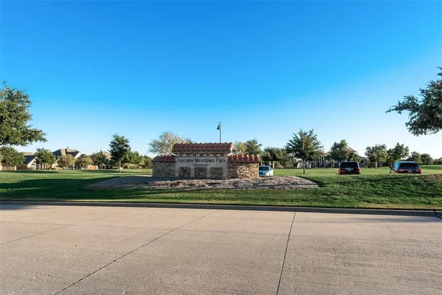 a view of a road with a building in the background