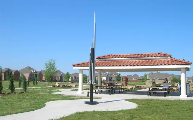 a view of a building and yard with green space