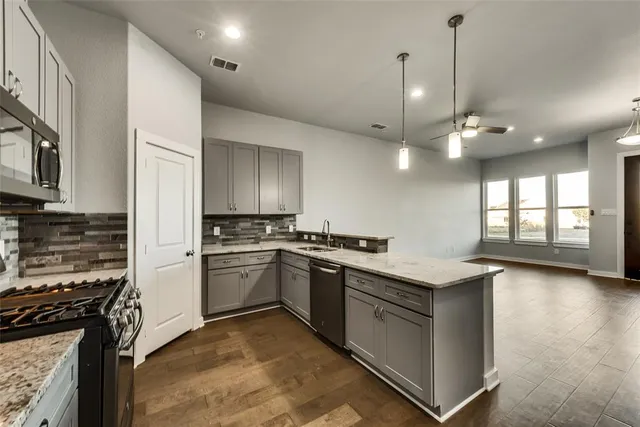 a kitchen with a stove and a sink