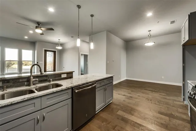 a view of a double sink and a large mirror in a room