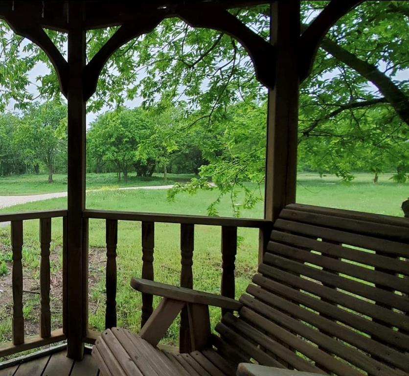 586 Pleasant Home Road Sherman, TX 75092 - Photo 19 of 25 a view of a porch with a yard