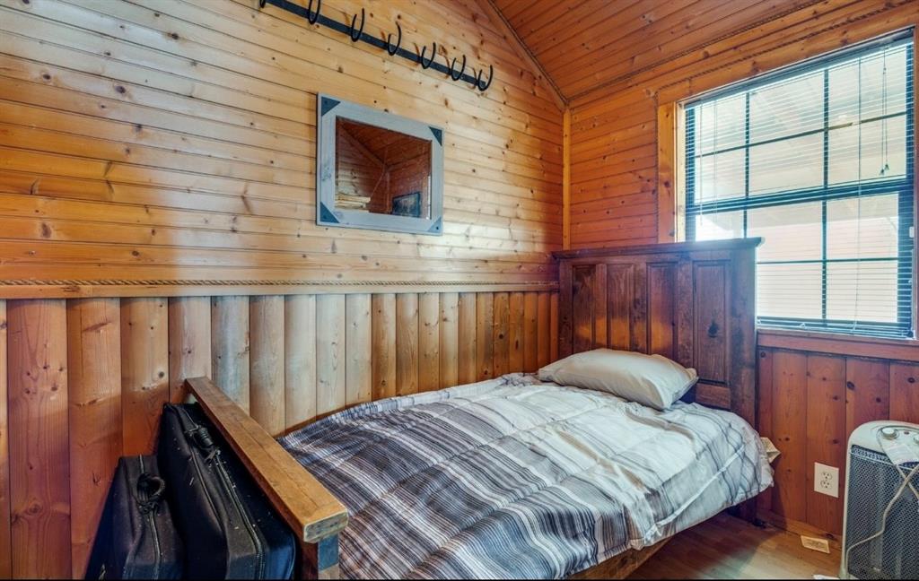 586 Pleasant Home Road Sherman, TX 75092 - Photo 23 of 25 a bedroom with a bed and a flat screen tv