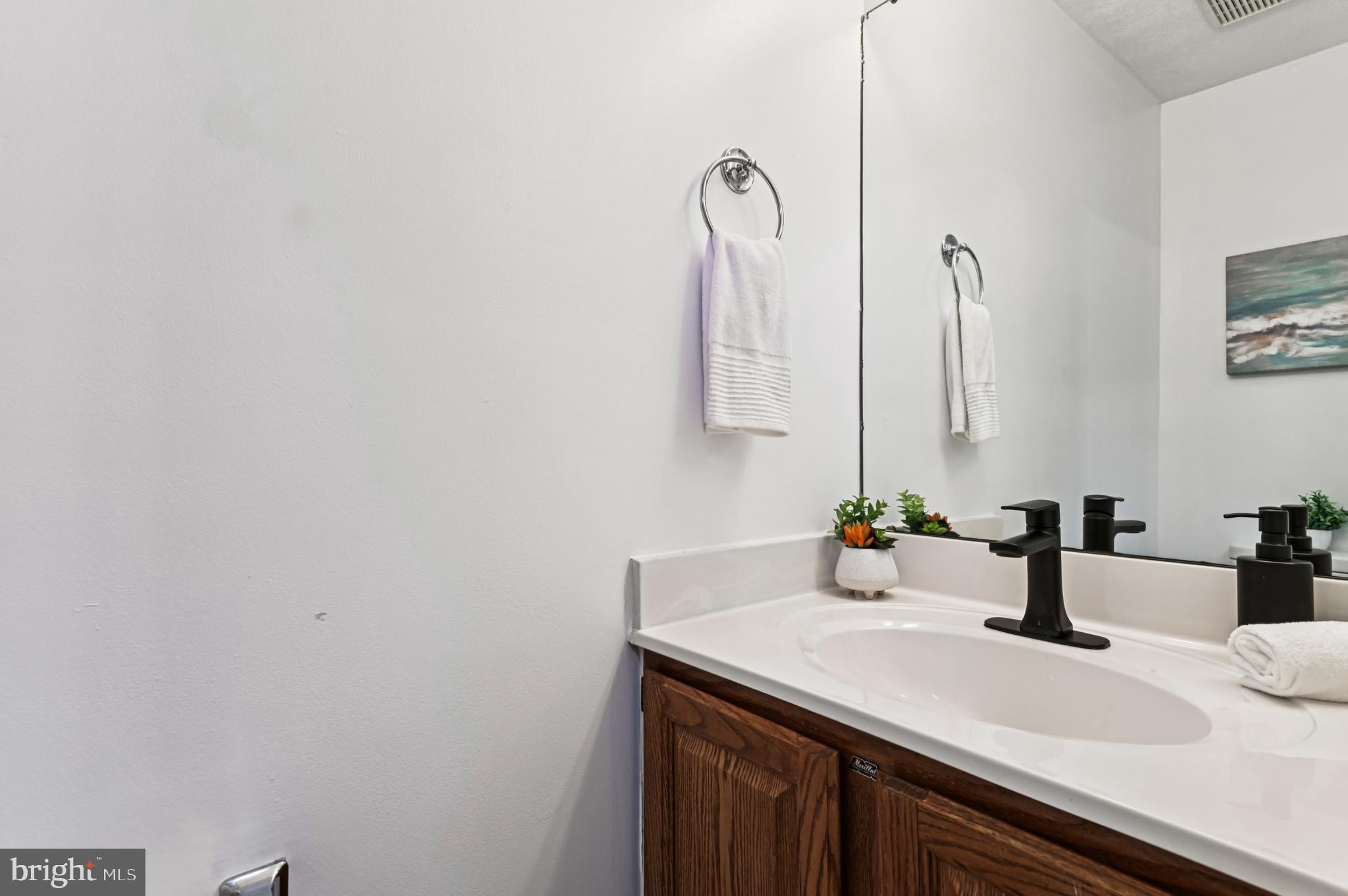 19 Championship Court, Unit K5 Owings Mills, MD 21117 - Photo 12 of 35 a bathroom with a sink and a mirror