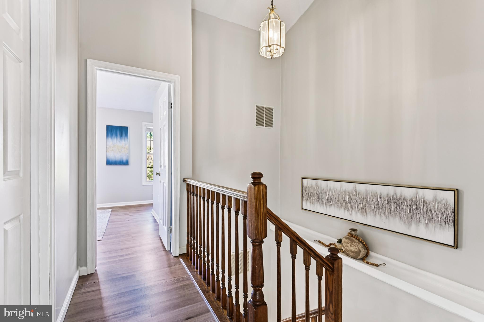 19 Championship Court, Unit K5 Owings Mills, MD 21117 - Photo 14 of 35 a view of a hallway with wooden floor and staircase