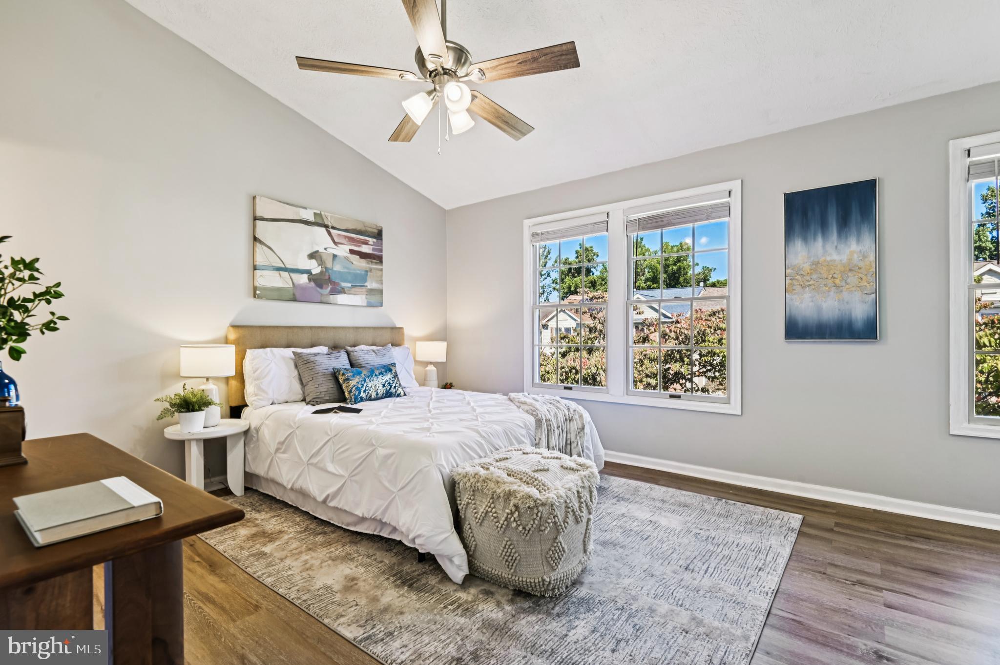 19 Championship Court, Unit K5 Owings Mills, MD 21117 - Photo 15 of 35 a bedroom with a bed and a table