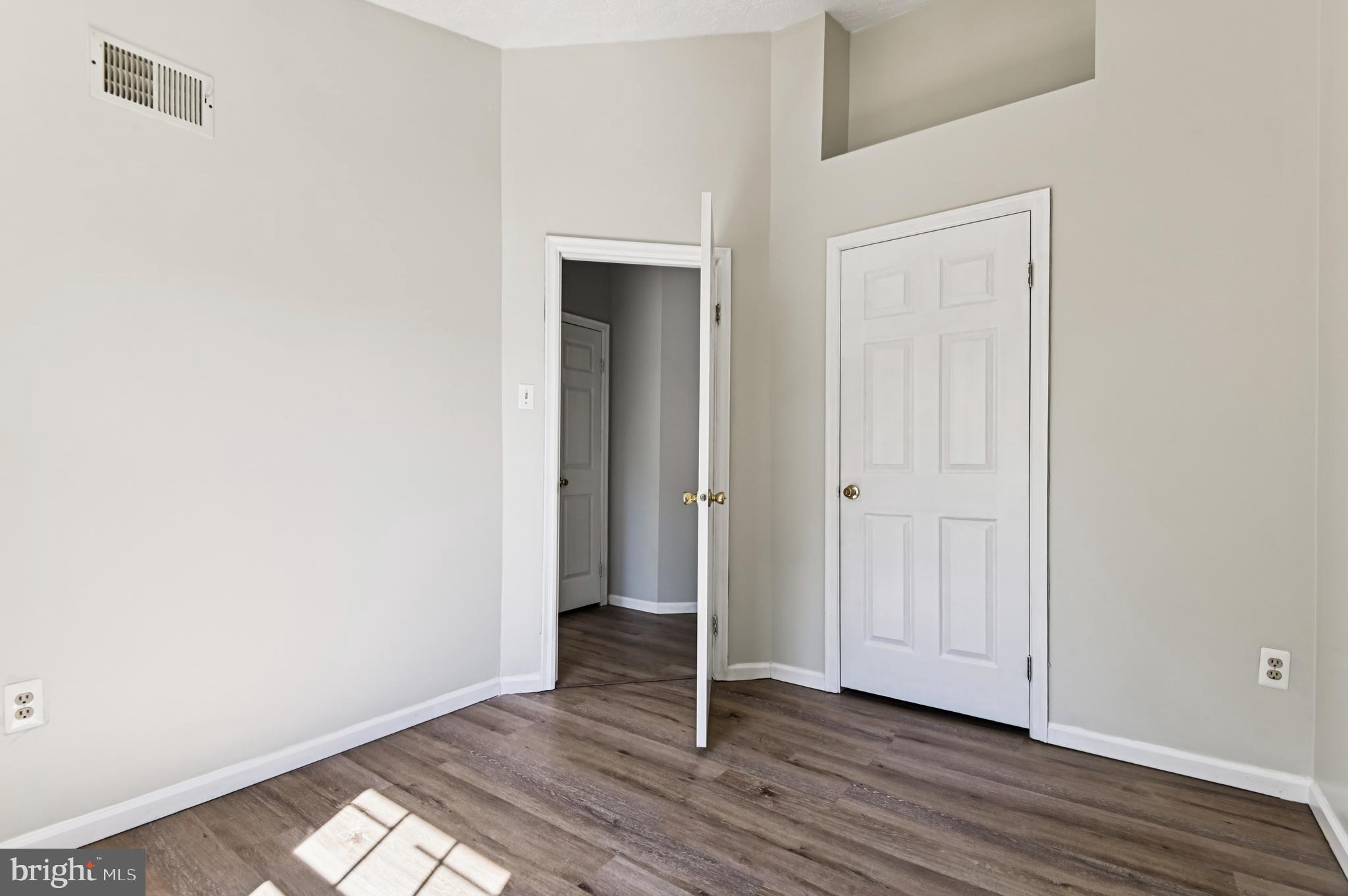 19 Championship Court, Unit K5 Owings Mills, MD 21117 - Photo 20 of 35 a view of a livingroom with wooden floor