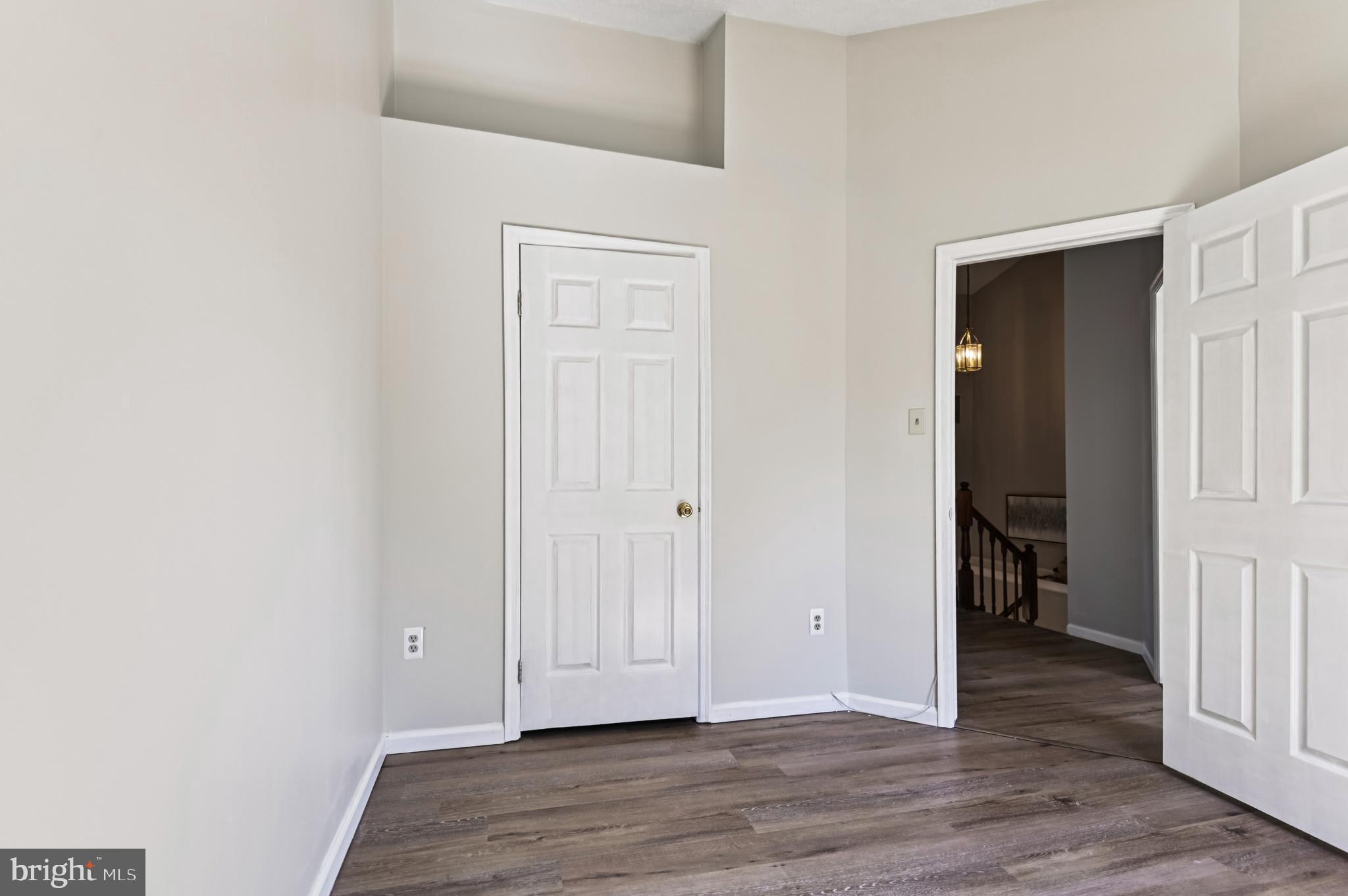 19 Championship Court, Unit K5 Owings Mills, MD 21117 - Photo 24 of 35 an empty room with wooden floor & closet