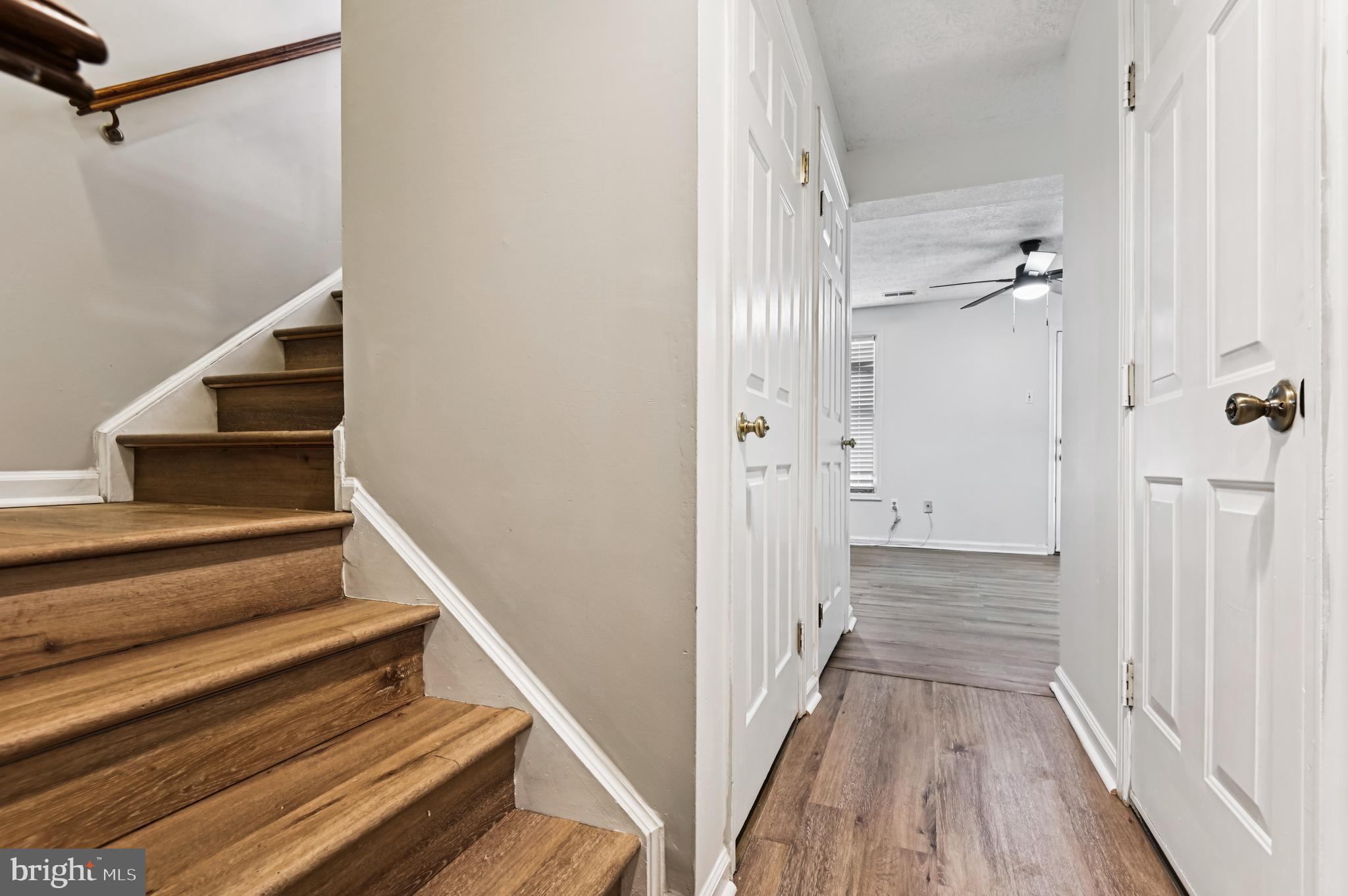 19 Championship Court, Unit K5 Owings Mills, MD 21117 - Photo 25 of 35 a view of a hallway with wooden floor and staircase