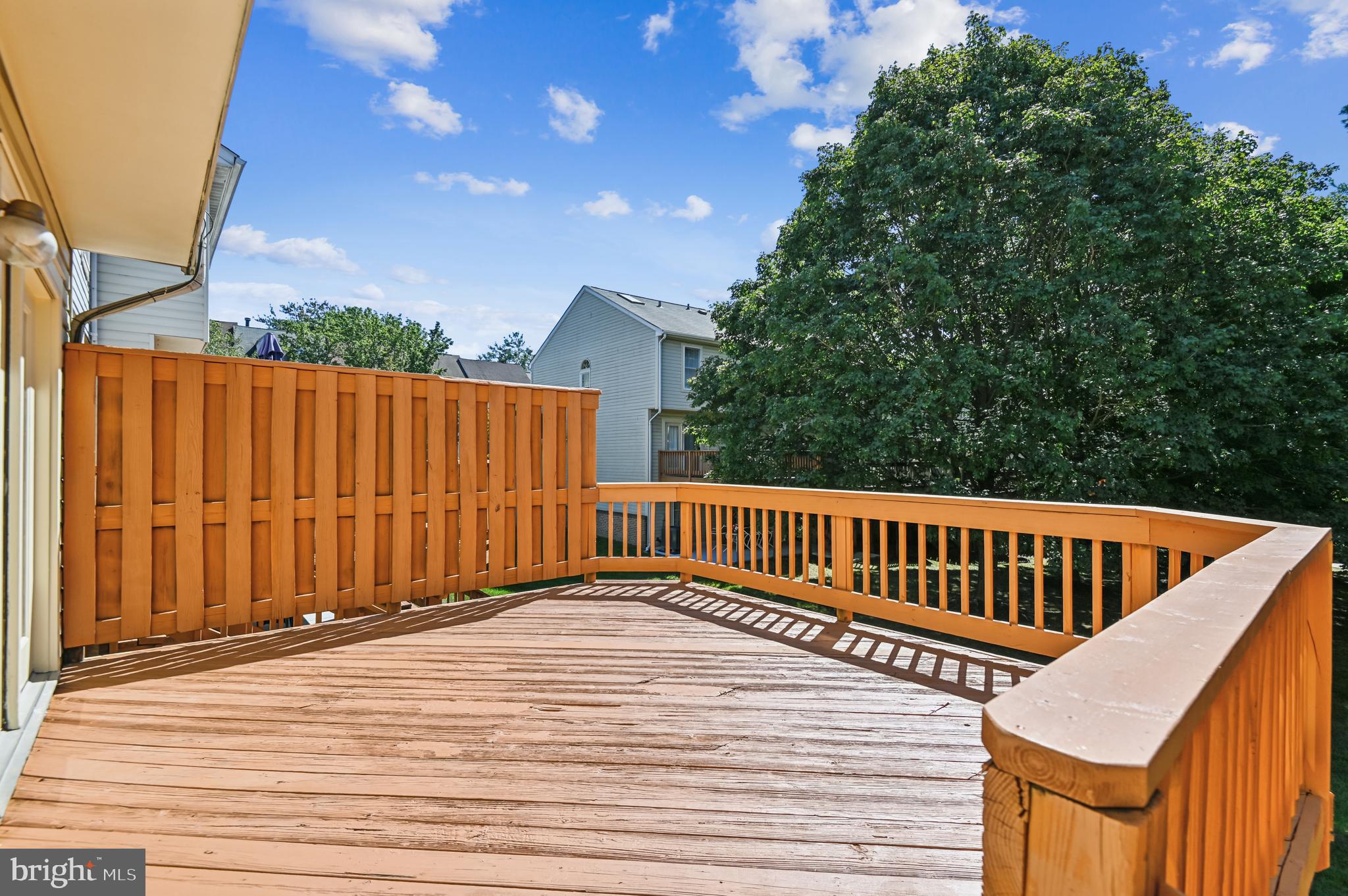 19 Championship Court, Unit K5 Owings Mills, MD 21117 - Photo 30 of 35 a view of a roof deck with wooden floor and fence