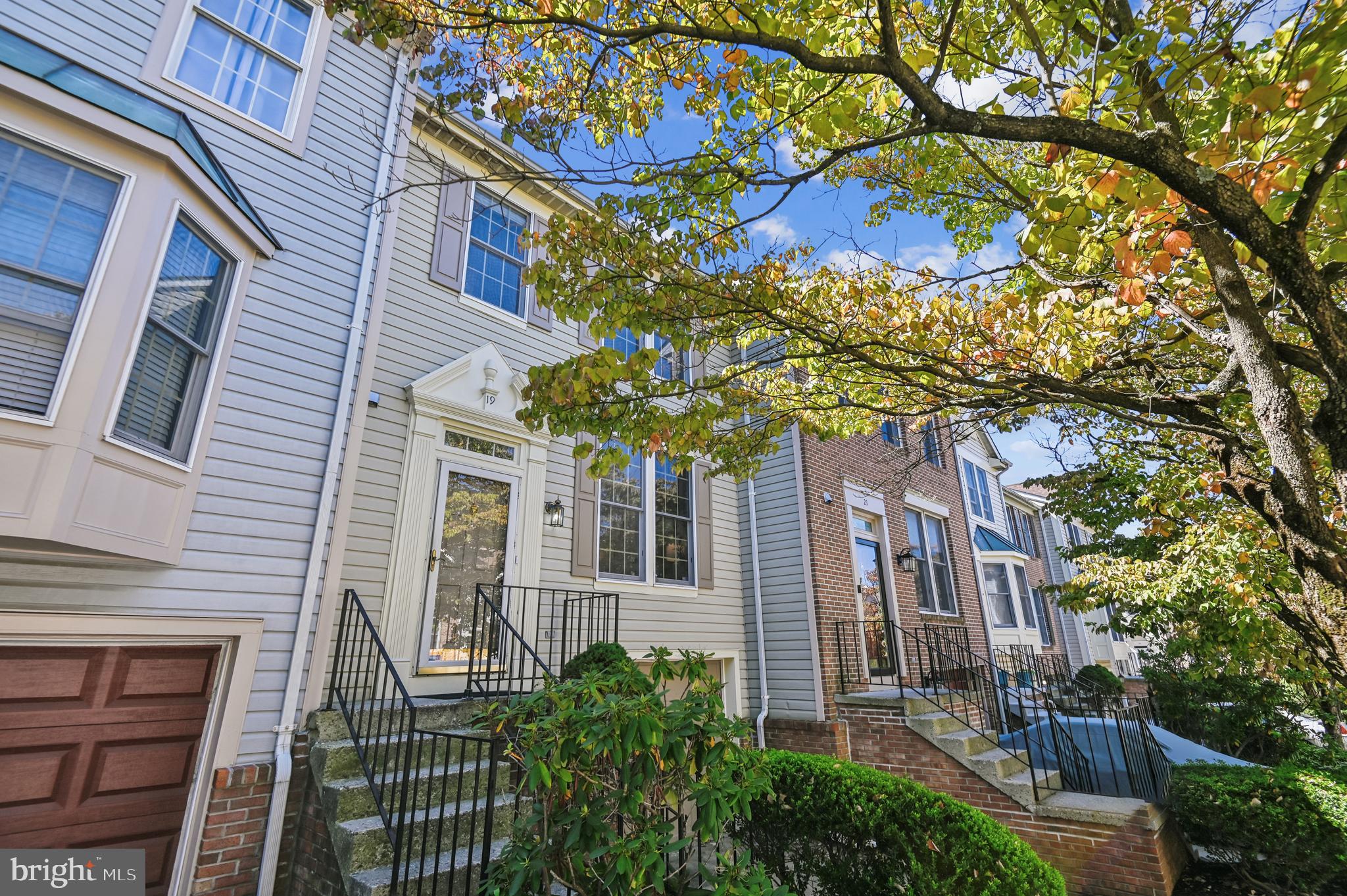 19 Championship Court, Unit K5 Owings Mills, MD 21117 - Photo 3 of 35 a view of a brick house with a tree front of house