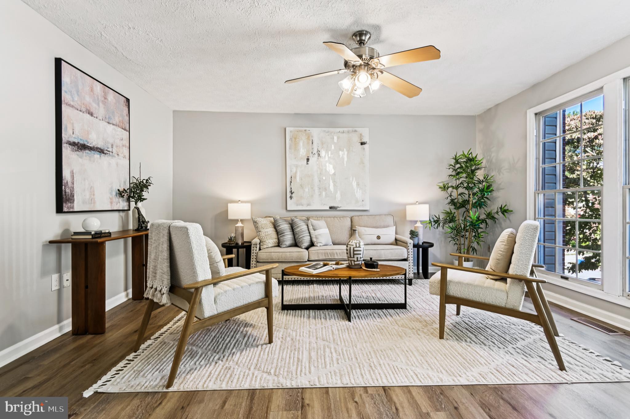 19 Championship Court, Unit K5 Owings Mills, MD 21117 - Photo 4 of 35 a living room with furniture and a large window