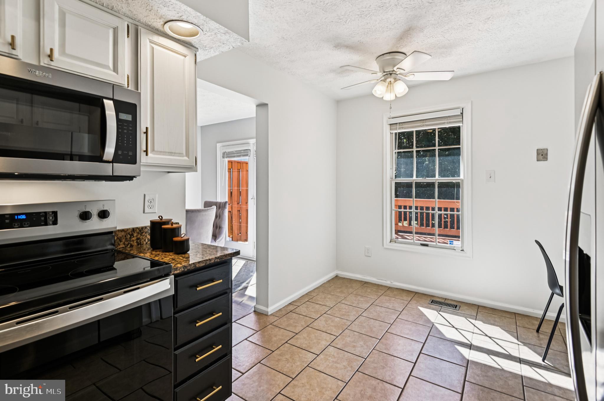 19 Championship Court, Unit K5 Owings Mills, MD 21117 - Photo 7 of 35 a view of kitchen with microwave stove and cabinets